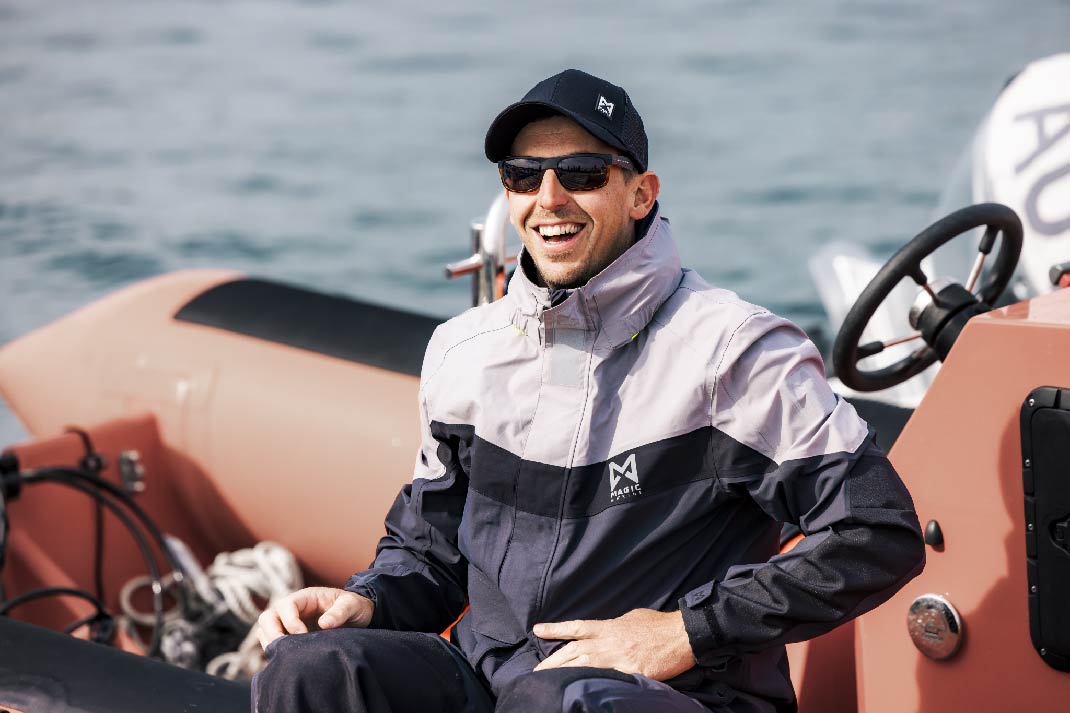 Male in Magic marine Racing Foul Weather Gear.