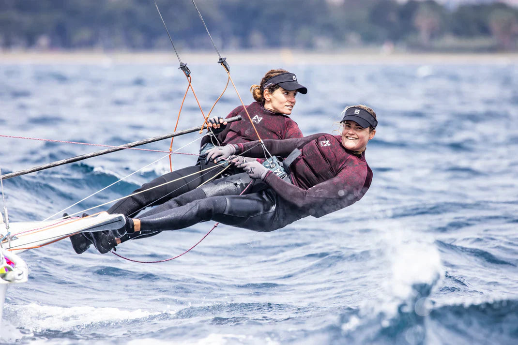 The woman in Magic Marine wetsuits racing.