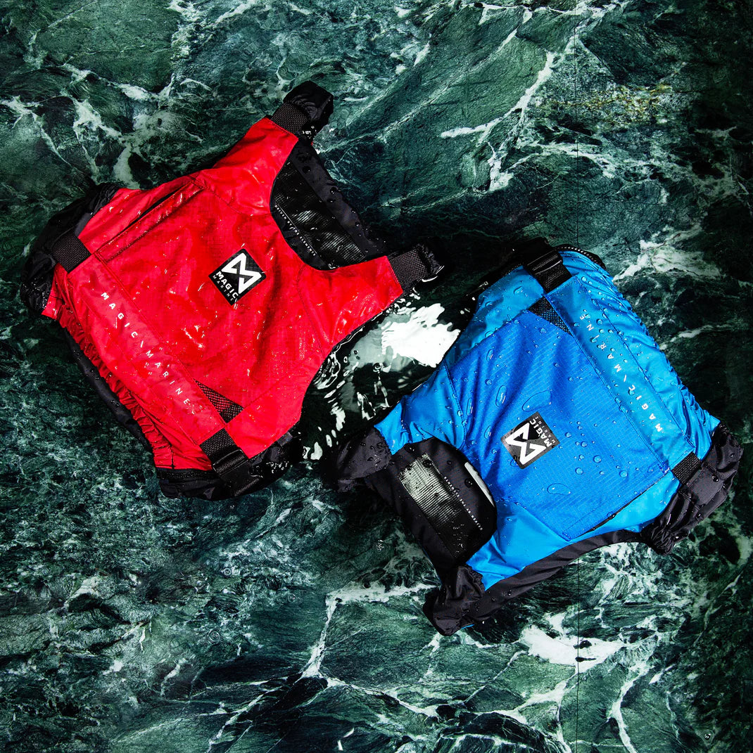 Red and blue Magic Marine life jackets on a rocky surface